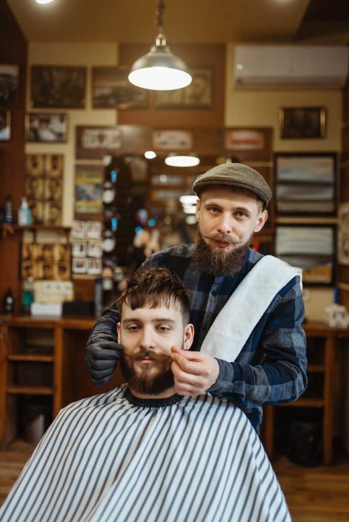 Barber and customer with a mustache, barbershop